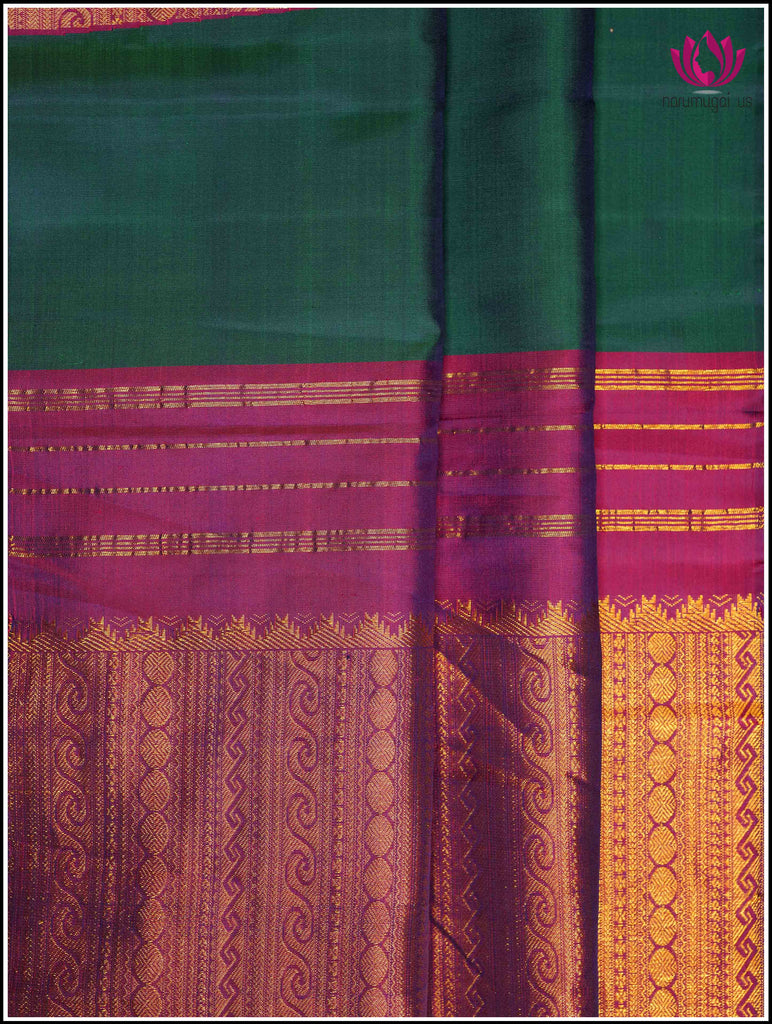 Kanchipuram silk saree in Emerald Green with a Unique zari woven temple design 1